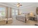 Inviting main bedroom with tray ceilings, generous natural light, and cozy seating area at 463 Old Piedmont Cir, Chapel Hill, NC 27516