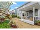 Inviting covered patio with comfortable seating and serene backyard views at 463 Old Piedmont Cir, Chapel Hill, NC 27516