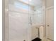 This walk-in shower features white marble-look tile, glass enclosure, and dual shower heads at 463 Old Piedmont Cir, Chapel Hill, NC 27516