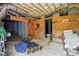 Unfinished basement with concrete walls, exposed ductwork, and storage shelving at 48 Arabella Ln, Clayton, NC 27520