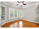 Bright room with hardwood floors and ample windows offering plenty of natural light at 48 Arabella Ln, Clayton, NC 27520