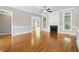 Large living room with hardwood floors, a cozy fireplace, and ample natural light at 48 Arabella Ln, Clayton, NC 27520