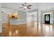 Open-concept living area with hardwood floors and seamless flow into the kitchen and dining spaces at 48 Arabella Ln, Clayton, NC 27520