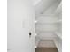 Pantry with built-in shelving, maximizing storage space and a neutral design at 48 Arabella Ln, Clayton, NC 27520