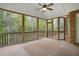 Spacious screened porch with views of nature, offering a relaxing outdoor living space at 48 Arabella Ln, Clayton, NC 27520