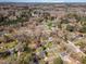 Wide aerial shot of this home, nestled in a vibrant community with lush greenery at 5033 Green Oak Dr, Durham, NC 27712