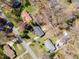Birds eye view of this homes neighborhood, and backyard deck with pergola and seating at 5033 Green Oak Dr, Durham, NC 27712
