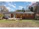 Relaxing backyard featuring a spacious deck and outdoor seating area, perfect for entertaining at 5033 Green Oak Dr, Durham, NC 27712
