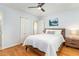Comfortable bedroom featuring hardwood floors, a bed with nightstand, and a closet at 5033 Green Oak Dr, Durham, NC 27712