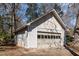 The detached two car garage features a basketball hoop, and an outdoor shed on the side at 5033 Green Oak Dr, Durham, NC 27712