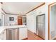Efficient kitchen with white cabinets, stainless steel appliances, and a convenient layout at 5033 Green Oak Dr, Durham, NC 27712