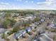 Aerial view of neighborhood highlighting mature trees and community pool at 504 Skygrove Dr, Holly Springs, NC 27540
