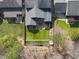 Aerial view of a home with a backyard oasis, including a patio and green lawn at 504 Skygrove Dr, Holly Springs, NC 27540