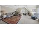 Spacious bonus room with carpeting, lots of natural light, and plenty of room for play and entertaining at 504 Skygrove Dr, Holly Springs, NC 27540