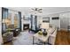 Comfortable living room features a cozy fireplace, plush seating, and bright windows at 504 Skygrove Dr, Holly Springs, NC 27540