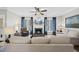 Inviting living room with fireplace, large windows, and comfortable seating arrangement at 504 Skygrove Dr, Holly Springs, NC 27540