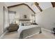 Tranquil main bedroom with vaulted ceilings, exposed beams, and neutral decor at 504 Skygrove Dr, Holly Springs, NC 27540