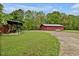 A yard with a shed and a house in the background at 5069 Cokesbury Rd, Fuquay Varina, NC 27526