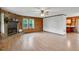 Bright living room featuring a stone fireplace and a large window for natural light at 5069 Cokesbury Rd, Fuquay Varina, NC 27526