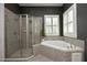 A modern bathroom offers a glass-enclosed shower, soaking tub, and a bright window at 515 Bexley Bluff Ln, Cary, NC 27513