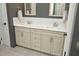 The spacious bathroom features a double vanity with marble countertop and custom cabinets at 515 Bexley Bluff Ln, Cary, NC 27513