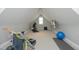 Spacious bonus room featuring gym equipment and a television at 515 Bexley Bluff Ln, Cary, NC 27513