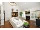 Elegant living room featuring a fireplace, tall ceilings, dark wood floors, and an open layout with natural light at 515 Bexley Bluff Ln, Cary, NC 27513