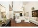 Spacious living area featuring tall ceilings, hardwood floors, stylish furnishings, and ample natural light at 515 Bexley Bluff Ln, Cary, NC 27513