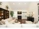 Spacious living room with a fireplace, high ceilings, dark wood floors, and large windows for plenty of natural light at 515 Bexley Bluff Ln, Cary, NC 27513