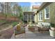 Staged outdoor patio with a variety of stylish seating arrangements and landscaping at 515 Bexley Bluff Ln, Cary, NC 27513
