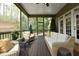 Spacious screened porch with wicker seating, a ceiling fan, and an exterior view at 515 Bexley Bluff Ln, Cary, NC 27513