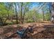 Scenic backyard view featuring mature trees and a tranquil creek, ideal for nature lovers seeking peace and privacy at 518 Morgan Creek Rd, Chapel Hill, NC 27517