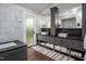 Elegant bathroom with marble walls, double vanity, and a soaking tub at 518 Morgan Creek Rd, Chapel Hill, NC 27517