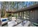 Exterior of home showcasing expansive deck with multiple seating areas at 518 Morgan Creek Rd, Chapel Hill, NC 27517