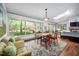 Bright dining room with large windows, skylight, comfortable seating, and open layout at 518 Morgan Creek Rd, Chapel Hill, NC 27517
