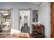 Open entryway leading to a living area with bar, coat rack, and a view to the outdoors at 518 Morgan Creek Rd, Chapel Hill, NC 27517