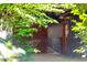 Charming home entrance with brick walkway, rustic wood siding, and decorative butterfly accent at 518 Morgan Creek Rd, Chapel Hill, NC 27517
