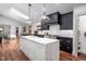 Modern kitchen featuring a marble island, stainless steel appliances, and beautiful hardwood flooring at 518 Morgan Creek Rd, Chapel Hill, NC 27517