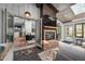 Living space with a brick fireplace, open doorway, and an adjacent kitchen at 518 Morgan Creek Rd, Chapel Hill, NC 27517
