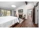 Spacious main bedroom with a fireplace, white shiplap and exposed beam ceilings at 518 Morgan Creek Rd, Chapel Hill, NC 27517