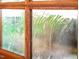 Close up of glass window, offering privacy with textured and slightly distorted view at 518 Morgan Creek Rd, Chapel Hill, NC 27517