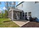 Exterior of a home featuring a screened porch and well-manicured backyard at 5209 Woodlawn Dr, Durham, NC 27703