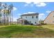 Home exterior with a screened porch overlooking a well-maintained backyard at 5209 Woodlawn Dr, Durham, NC 27703