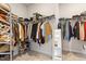 Spacious walk-in closet with ample shelving and hanging space, providing organized storage for clothing and accessories at 5209 Woodlawn Dr, Durham, NC 27703