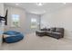 Spacious living room with natural light and comfortable seating at 5209 Woodlawn Dr, Durham, NC 27703