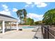 Community pool area with lounge chairs, tables and a covered patio for shade at 5209 Woodlawn Dr, Durham, NC 27703