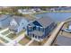 Aerial view of home featuring a covered front porch, landscaped yard and an attached rear garage at 5712 Agrinio Way, Raleigh, NC 27603