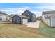 Large backyard with lush green grass and a long driveway at 5712 Agrinio Way, Raleigh, NC 27603
