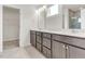 A spacious bathroom showcases double sinks, ample cabinet space, and a walk-in shower at 5712 Agrinio Way, Raleigh, NC 27603