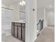 Bathroom featuring a shower and tub, toilet, dark vanity and wide mirror near a staircase at 5712 Agrinio Way, Raleigh, NC 27603
